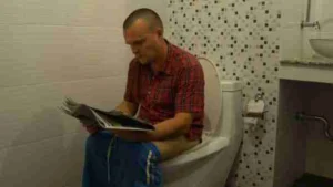 depositphotos 201971452 stock video a man sitting on the