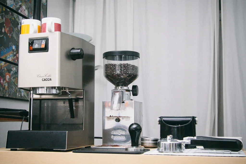 Best Espresso Grinder Under $200 (2026): 6 Picks Compared 1 Home espresso setup with a Gaggia Classic espresso machine, a burr grinder and a tamper